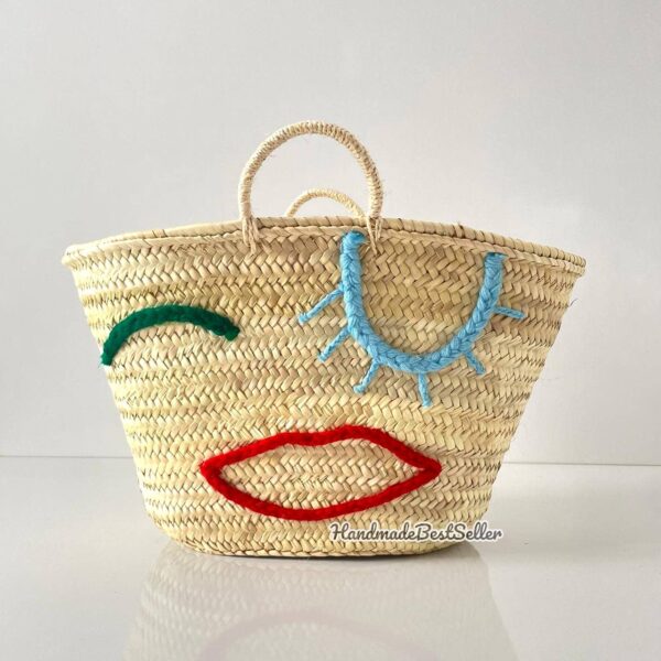 Beautiful handwoven straw bag with eye embroidery